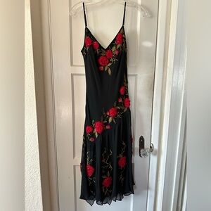 Chic Black Dress with Red Floral Design